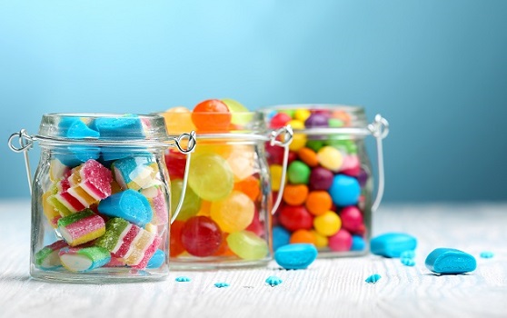 What is the role of flow meters in candy manufacturing?