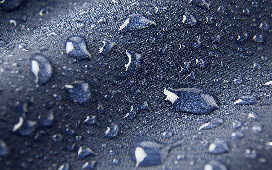 Water drops in blue hydrophobic coat
