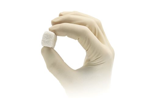 piece of Synthetic bone material in a hand 