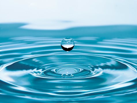 blue drop falling into water